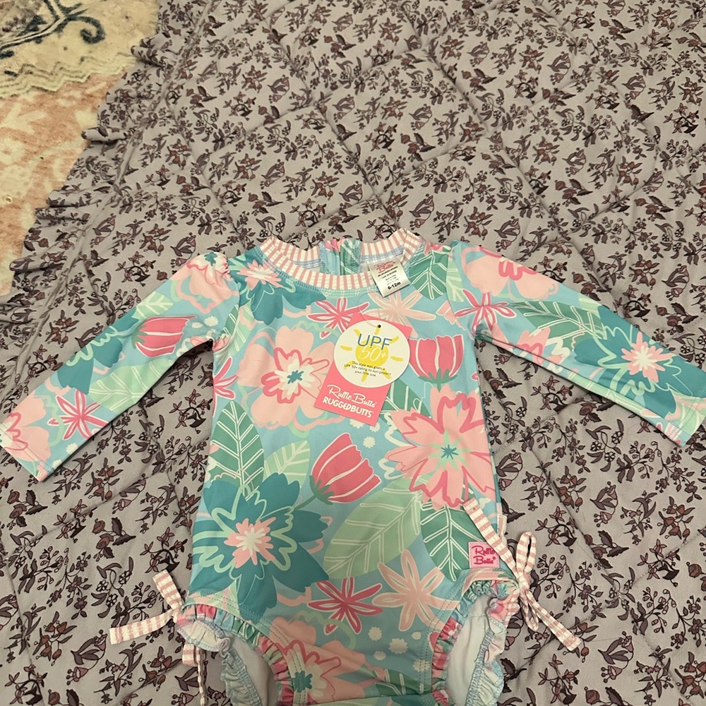 RuffleButts Floral Long Sleeve Swimsuit